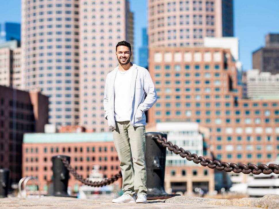 Student in front of Boston MA buildings