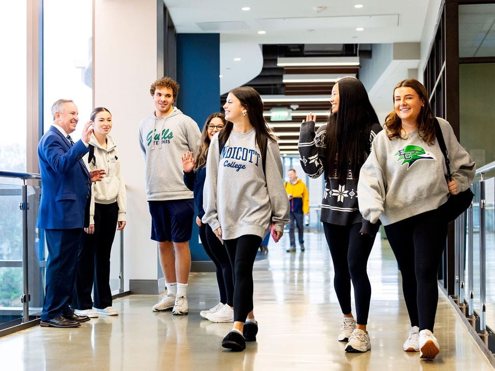 Students with President DiSalvo in the hallway