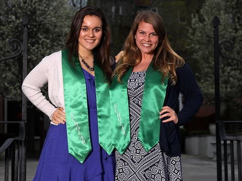 two students at honors gala wearing their honors sashes